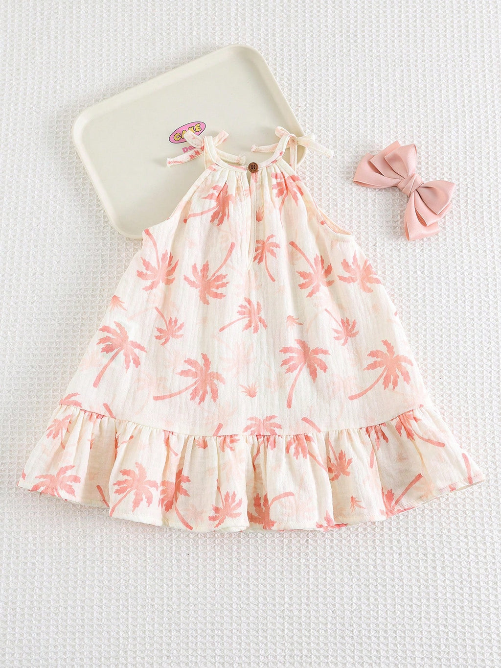 Robe d'été décontractée sans manches Bambinoo x Cozy Pixies pour bébé fille avec imprimé floral et plantes tropicales