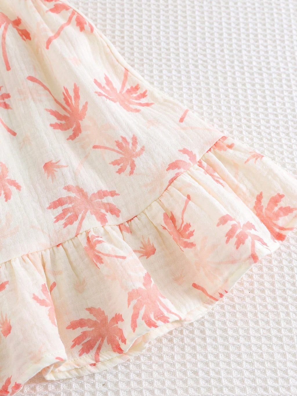 Robe d'été décontractée sans manches Bambinoo x Cozy Pixies pour bébé fille avec imprimé floral et plantes tropicales