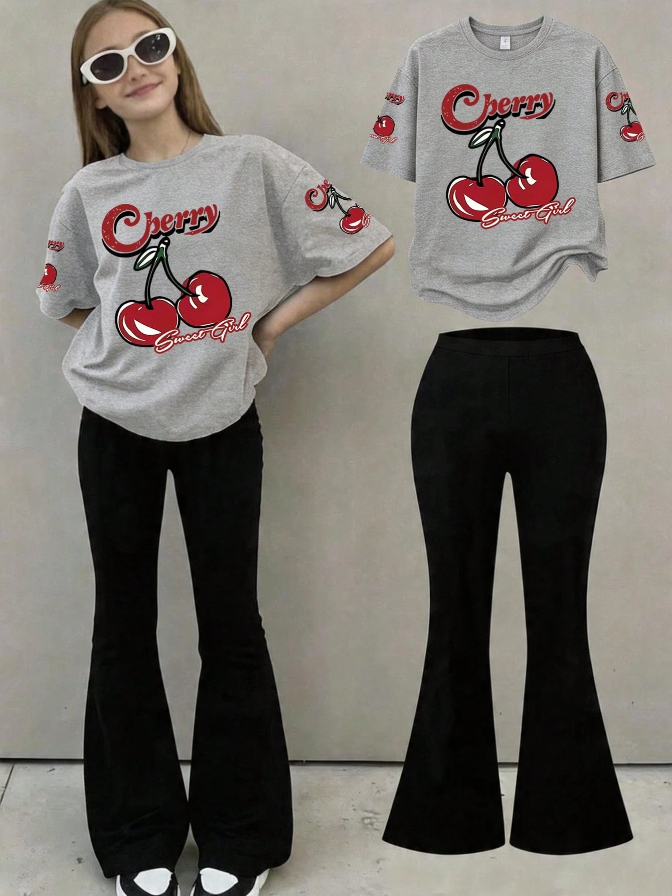 This Casual Girls' Set Includes A Round Neck T-Shirt With Cherry Print And Black Flare Pants. Whether For School, Shopping, Street Style, Or Vacation, It Is An Excellent Choice. Grey