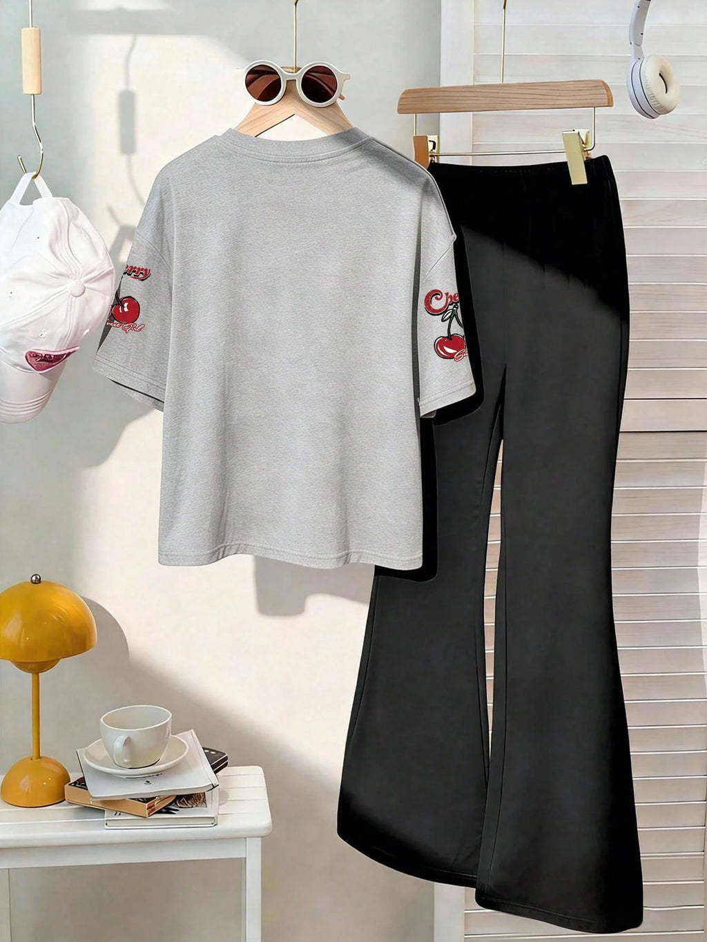 This Casual Girls' Set Includes A Round Neck T-Shirt With Cherry Print And Black Flare Pants. Whether For School, Shopping, Street Style, Or Vacation, It Is An Excellent Choice. Grey